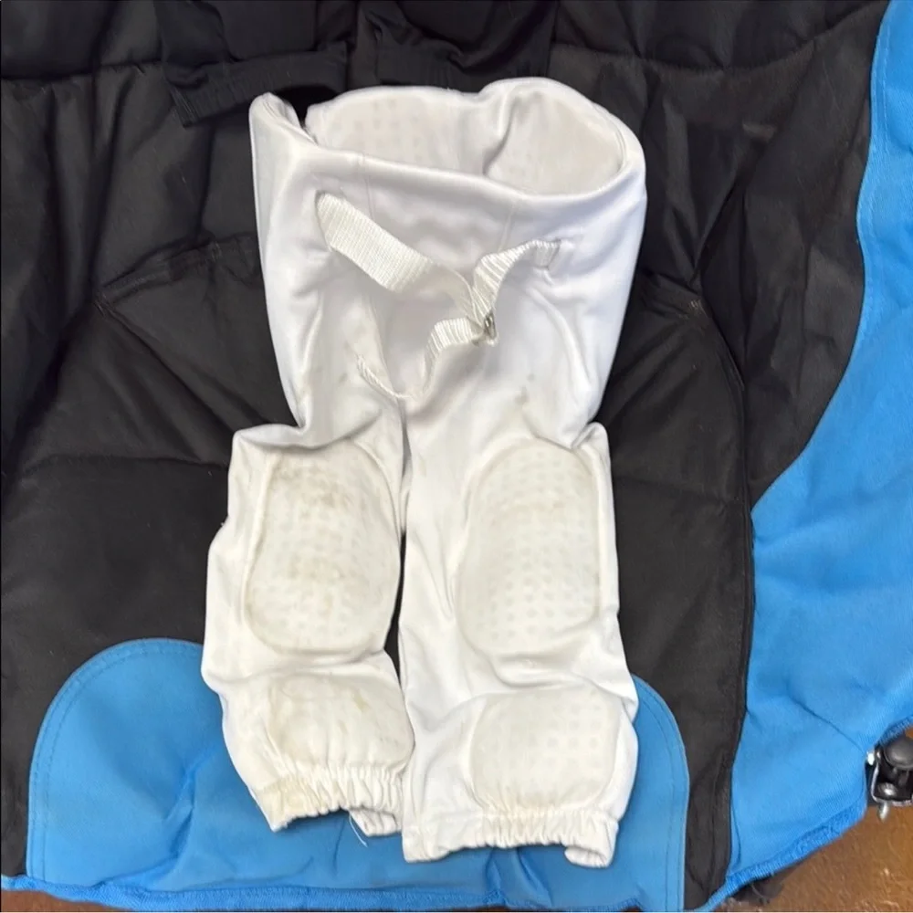 Two pairs of boys football pants size small